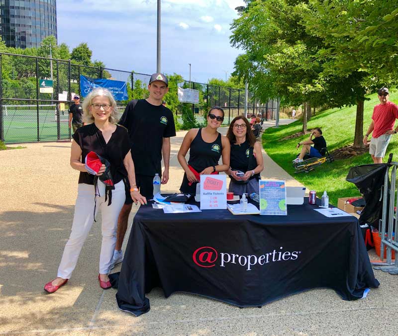 Pickleball registration table sponsored by @properties