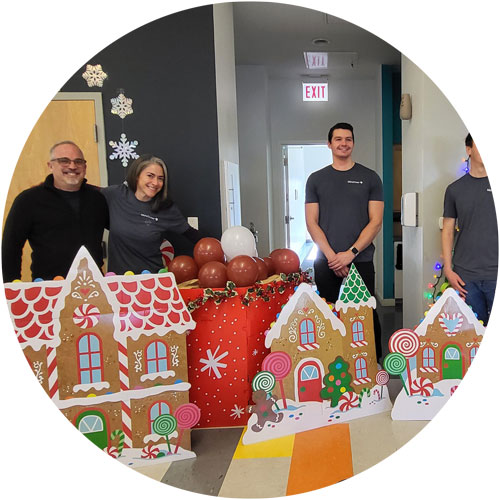 Mesirow volunteers with gingerbread houses